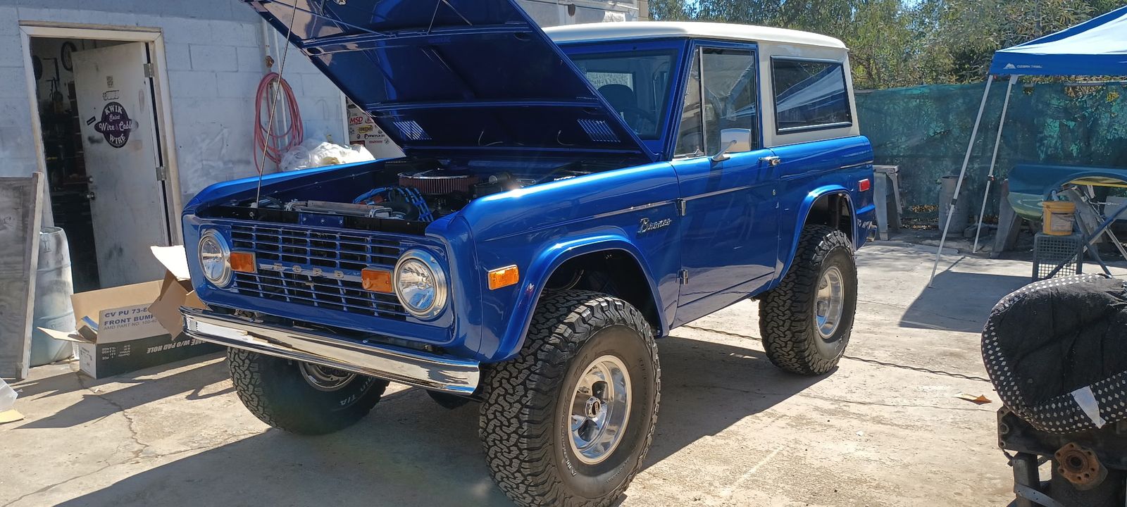 Ford Bronco — Front three-quarter, hood up.