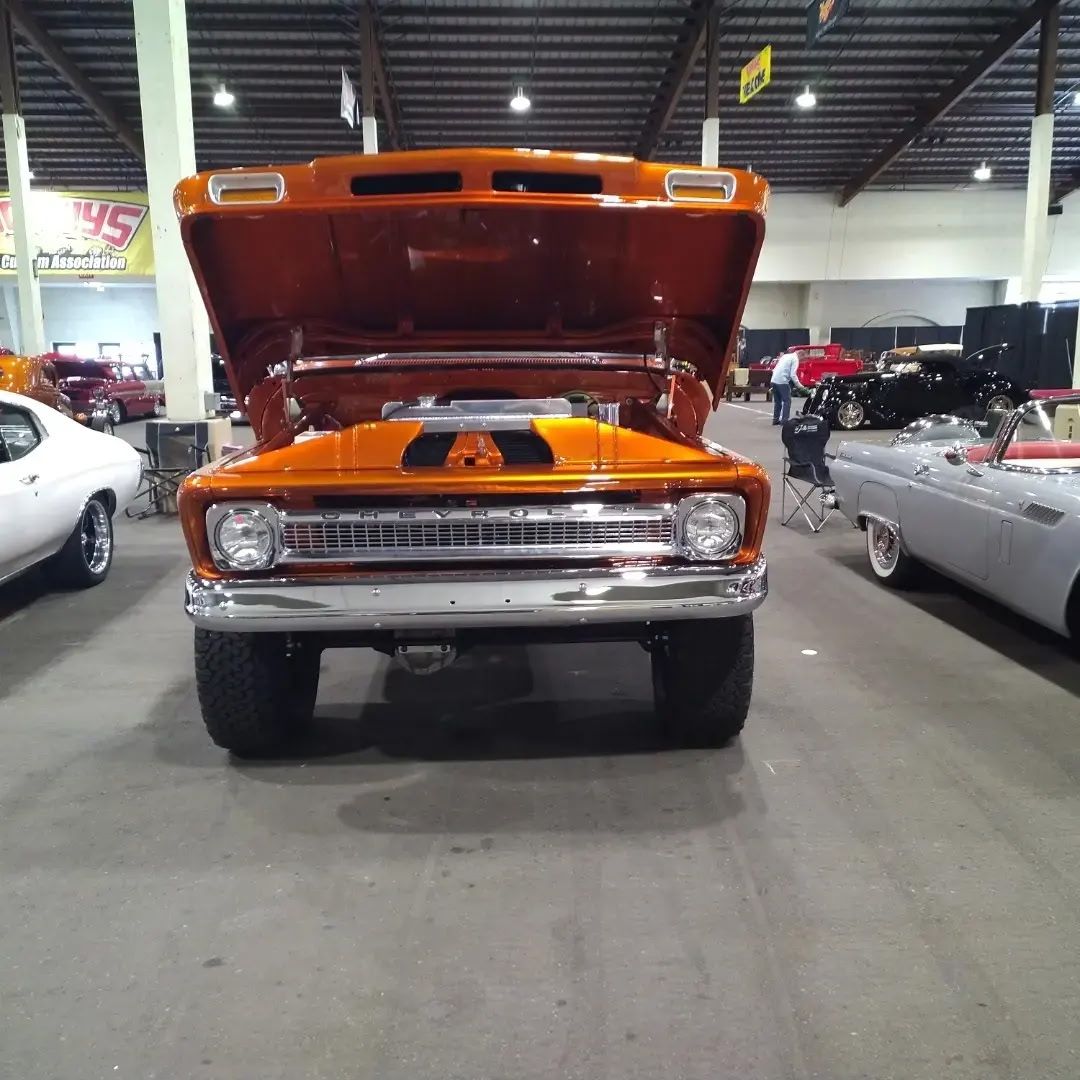 1965 Chevrolet C10 4x4 — Front end, hood up.