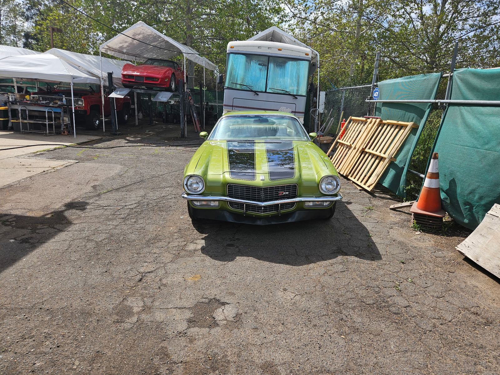 1971 Camaro Z/28 — Head-on at the shop, stripes over the hood.