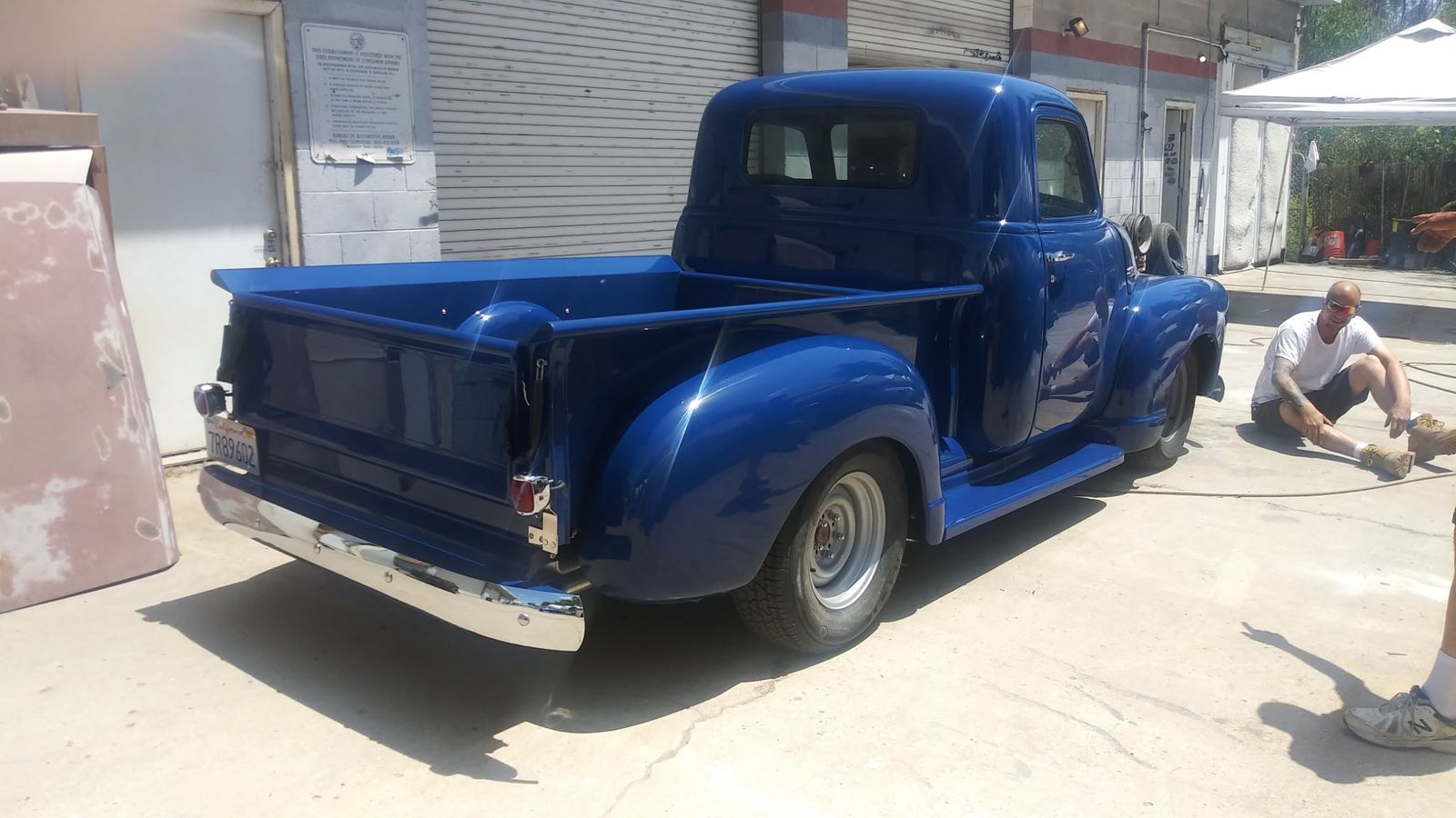 Chevrolet 3100 — Rear three-quarter, painted bed.