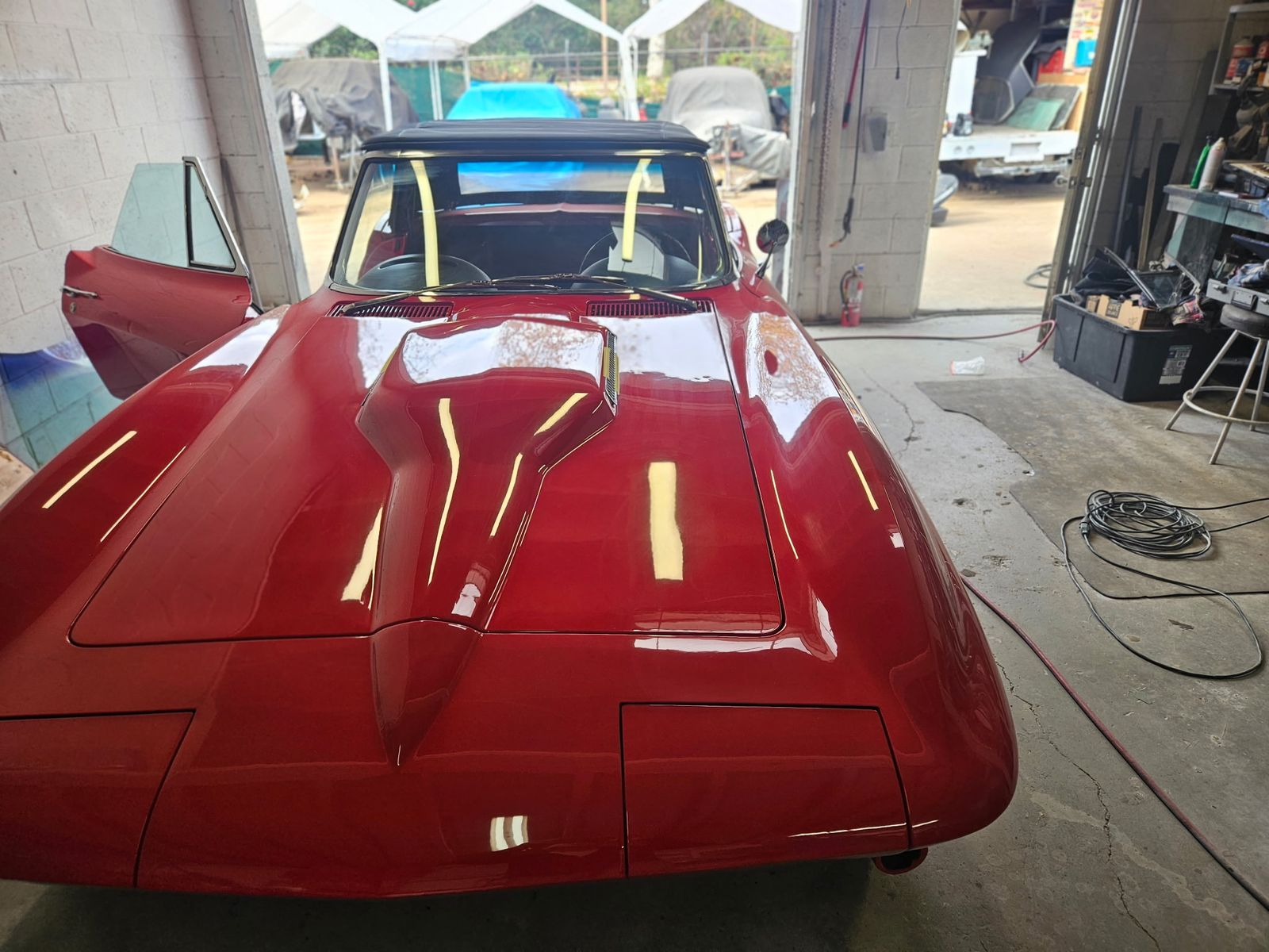 1966 Corvette Sting Ray — Nose and hood, masking still on the windshield posts.