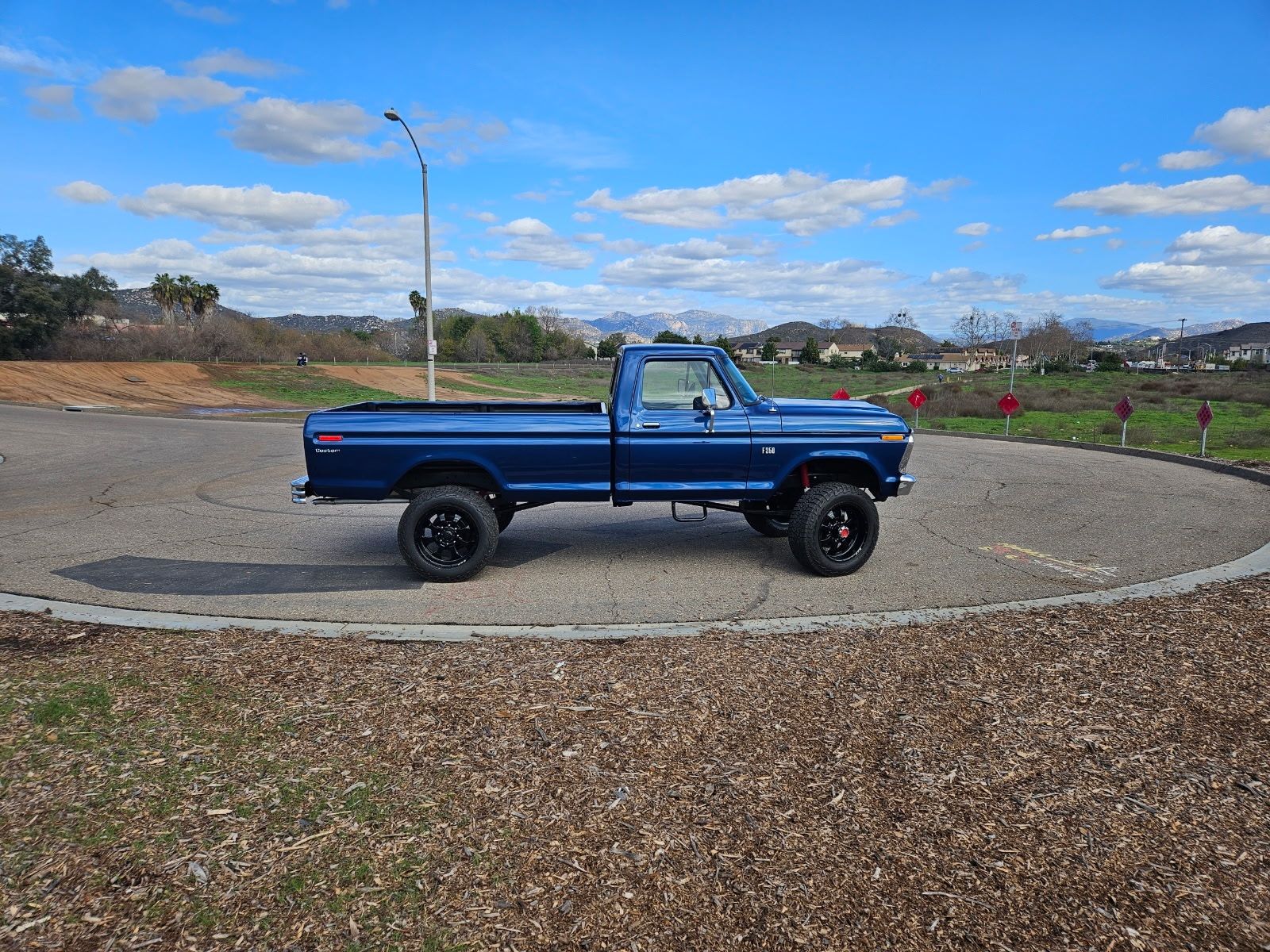 Ford F-250 4x4 — Side profile, out of the shop.