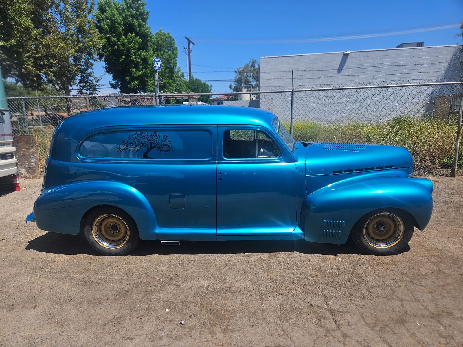 Candy teal metallic Chevrolet Sedan Delivery restored by M & J Restorations, full side profile